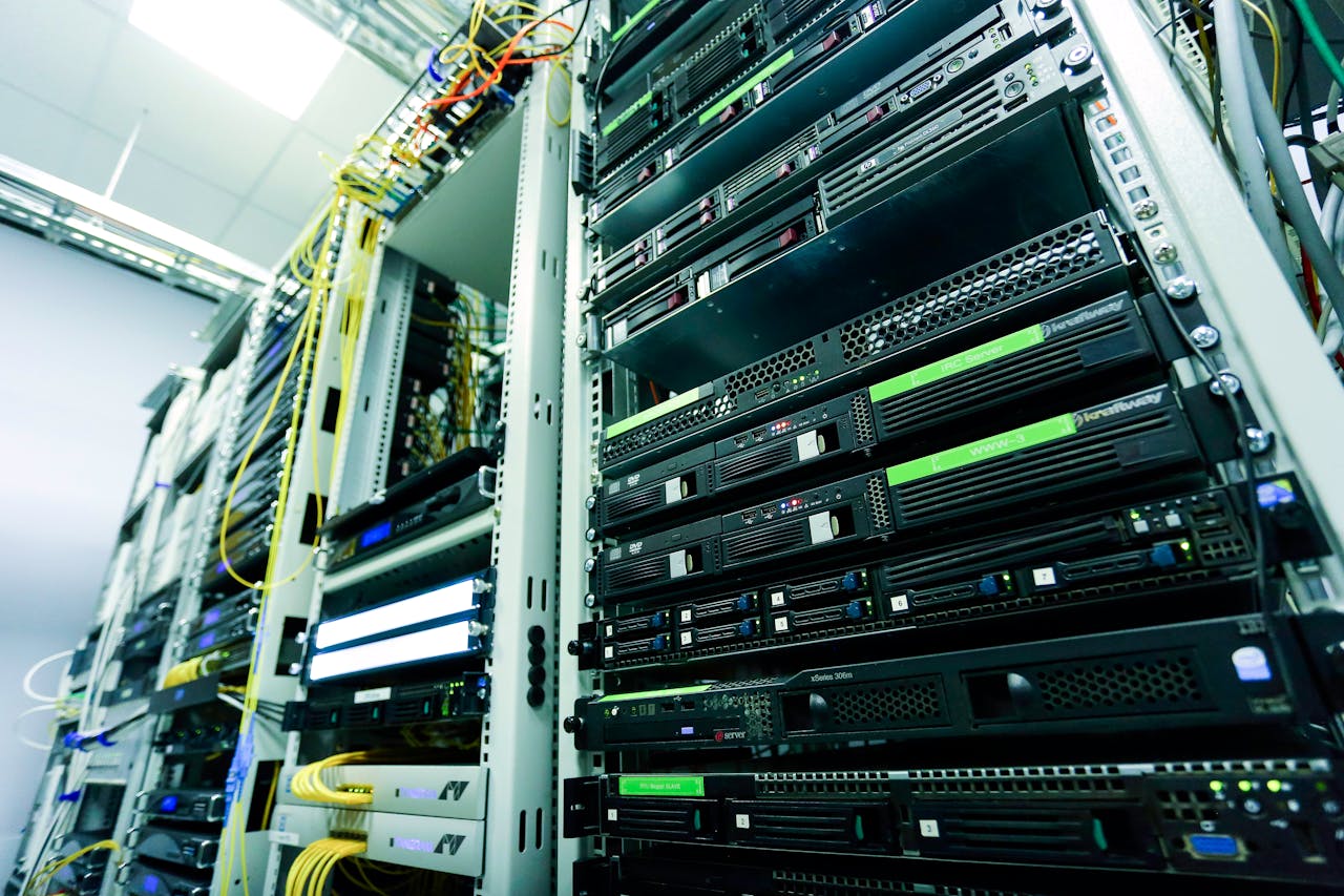 services-02 High-tech server rack in a secure data center with network cables and hardware components.